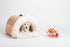 Calming Plush Pet Bed for Cats & Small Dogs shown with a small dog inside a cozy, semi-enclosed design for comfort.